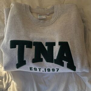 TNA Light Gray Sweatshirt with Dark Green Lettering